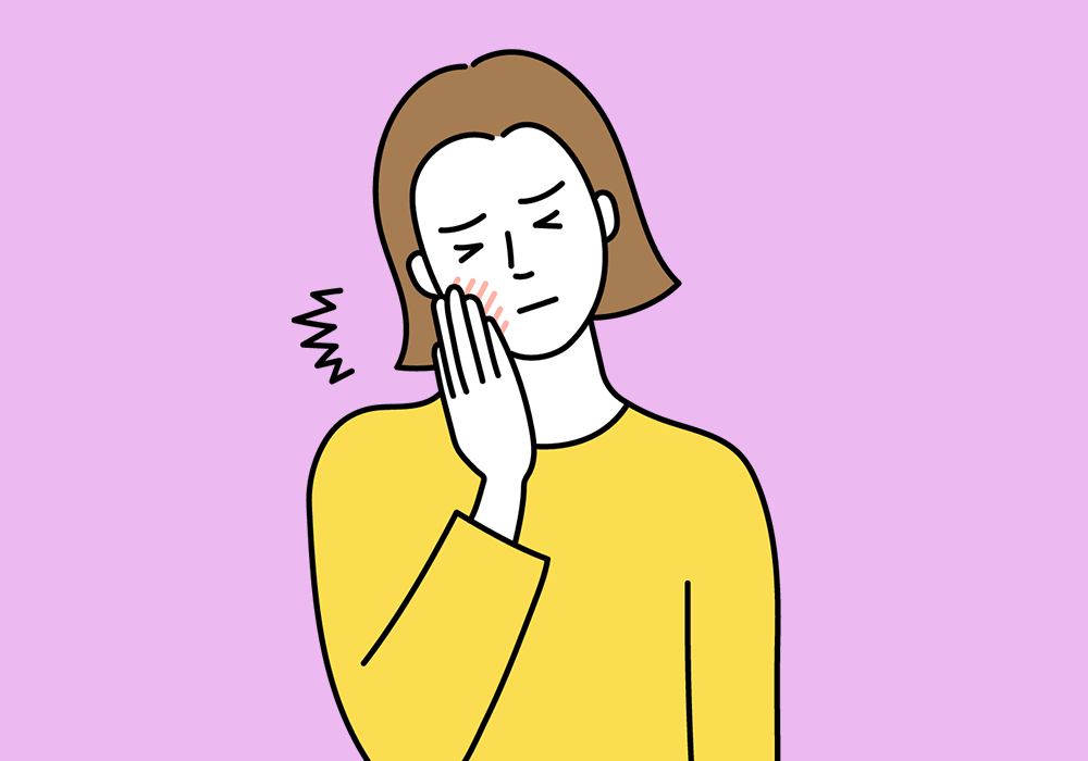 歯茎が痛む女性